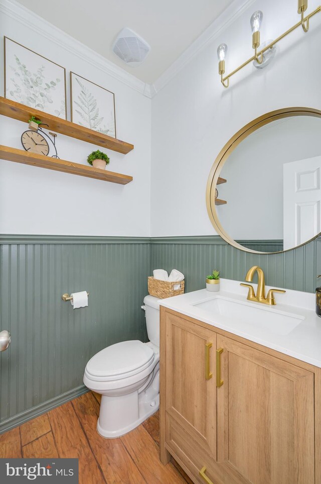 109 Manila Pl, Stephenson, VA 22656 - bathroom featuring toilet, wood finished floors, a wainscoted wall, vanity, and crown molding