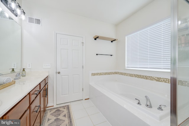 109 Manila Pl, Stephenson, VA 22656 - bathroom featuring a garden tub, double vanity, and tile patterned flooring