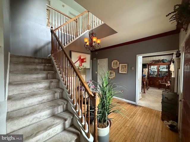 11 Morlatton Rd, Douglassville, PA 19518 - stairs with wood-type flooring, baseboards, and a chandelier