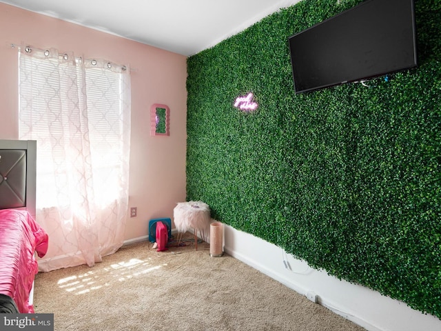 unfurnished bedroom featuring baseboards and carpet
