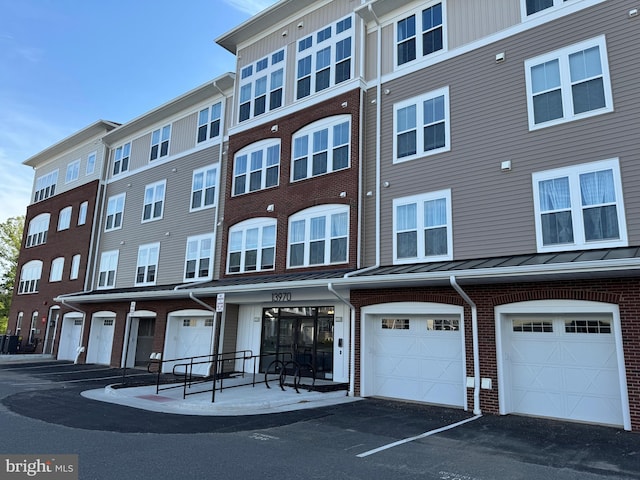 13970 Englefield Dr Unit 207, Woodbridge, VA 22193 - view of property featuring driveway and a garage