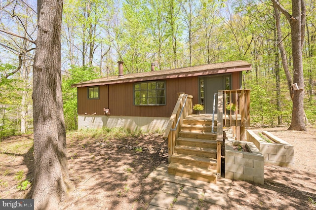view of front of property with roof with shingles