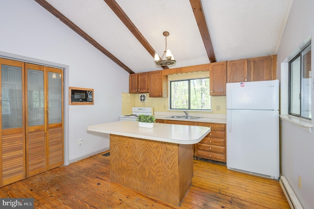 kitchen with baseboard heating, a sink, light countertops, lofted ceiling with beams, and white appliances