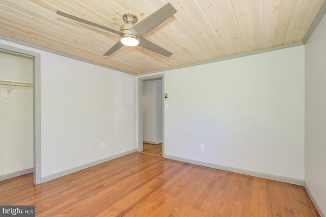 unfurnished bedroom with a ceiling fan, wooden ceiling, baseboards, a closet, and light wood finished floors