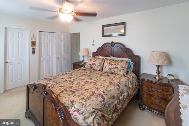 bedroom featuring a ceiling fan and light carpet