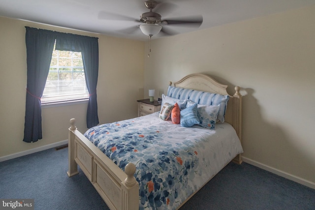 bedroom featuring carpet floors, a ceiling fan, and baseboards