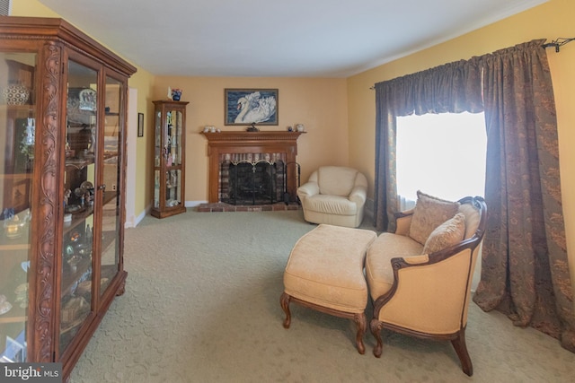 living area with a fireplace and light colored carpet