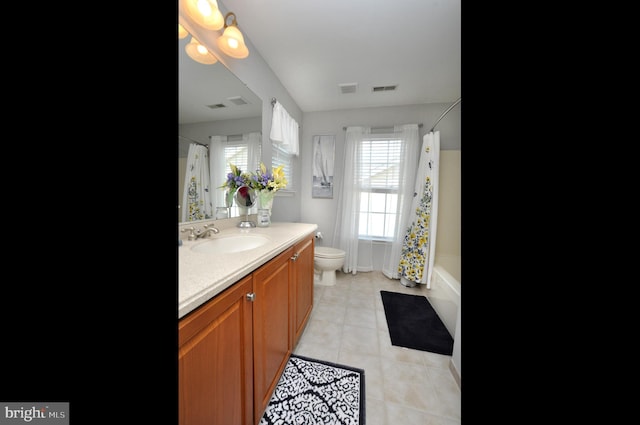 full bath featuring vanity, tile patterned floors, visible vents, and toilet