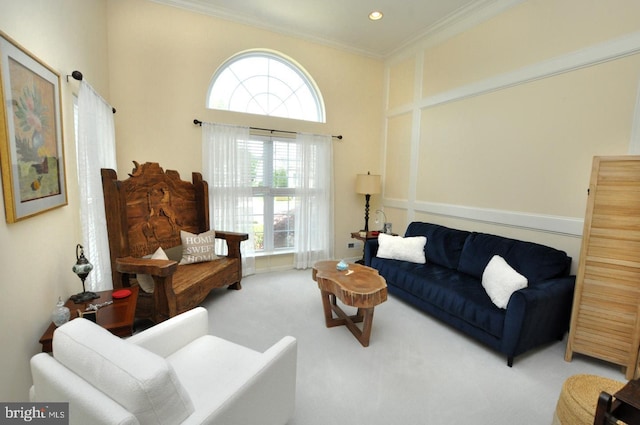 living room with recessed lighting, carpet flooring, a wealth of natural light, and ornamental molding