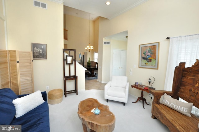 living room with a chandelier, visible vents, and carpet