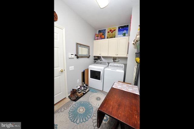 laundry area featuring cabinet space and independent washer and dryer