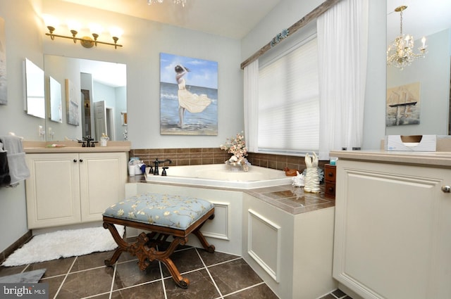 full bathroom featuring vanity, tile patterned flooring, and a garden tub