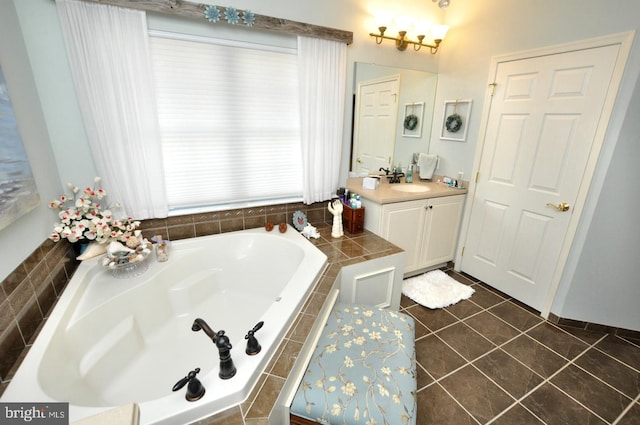 bathroom with vanity, tile patterned flooring, and a garden tub