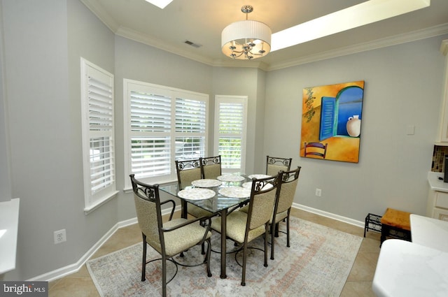 dining area featuring visible vents, crown molding, light tile patterned floors, baseboards, and an inviting chandelier