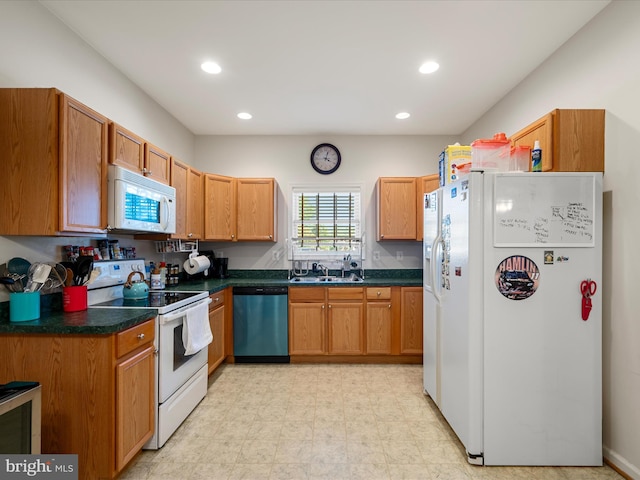 628 Allegheny Cir, Woodstock, VA 22664 - kitchen with white appliances, a sink, dark countertops, recessed lighting, and brown cabinets