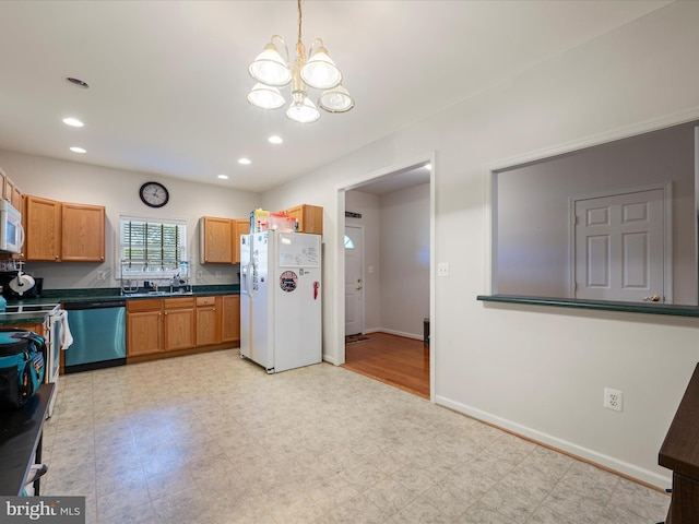 628 Allegheny Cir, Woodstock, VA 22664 - kitchen featuring white appliances, a chandelier, light floors, dark countertops, and recessed lighting
