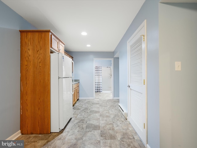 628 Allegheny Cir, Woodstock, VA 22664 - kitchen with freestanding refrigerator, baseboard heating, recessed lighting, baseboards, and brown cabinetry