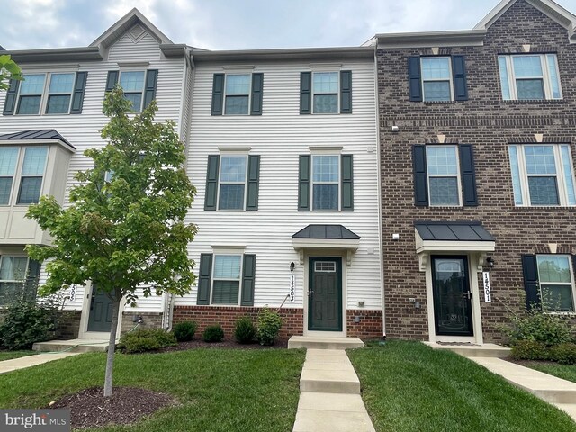 14503 Hunts Farm Rd, Brandywine, MD 20613 - townhome / multi-family property with brick siding and a front yard