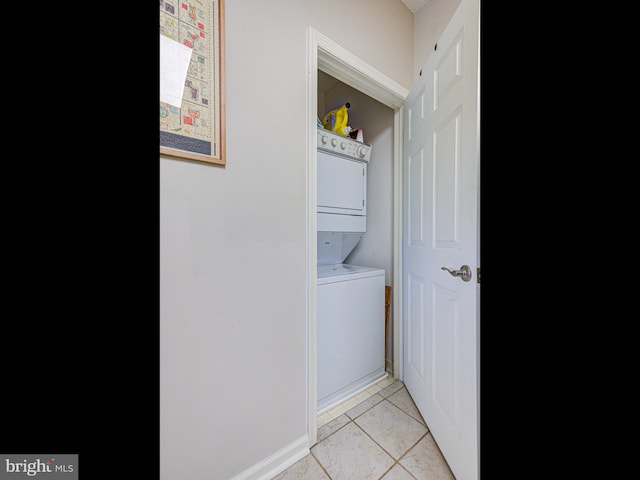1720 Lake Shore Crest Dr Unit 35, Reston, VA 20190 - clothes washing area with laundry area, stacked washing maching and dryer, and light tile patterned floors