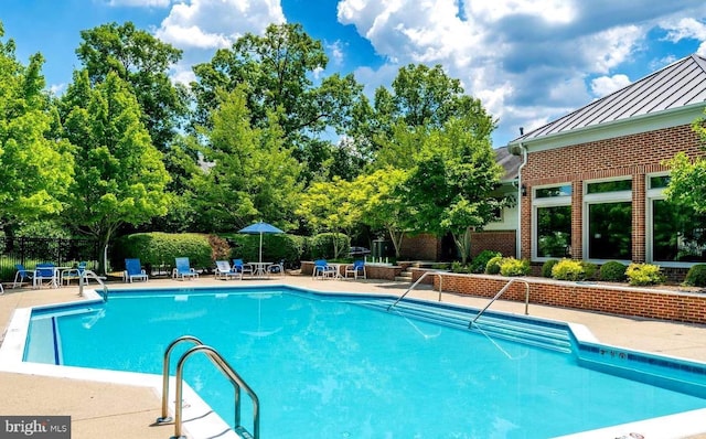1720 Lake Shore Crest Dr Unit 35, Reston, VA 20190 - community pool featuring a patio and fence