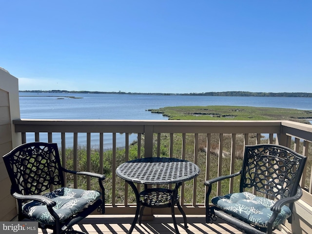 balcony featuring a water view