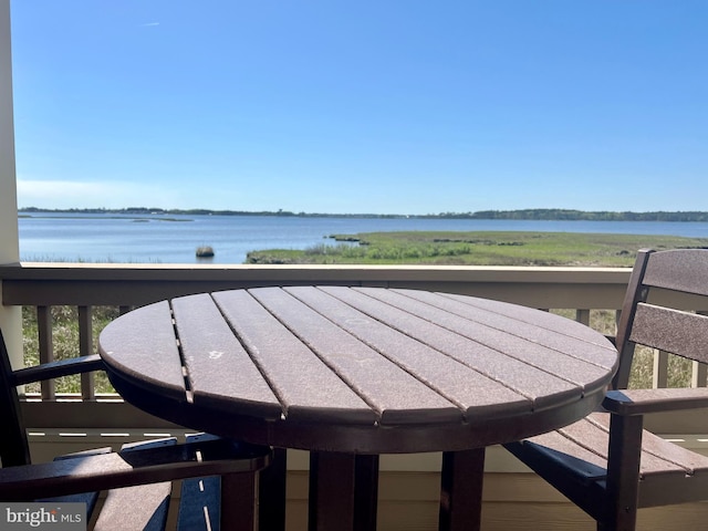 balcony featuring a water view