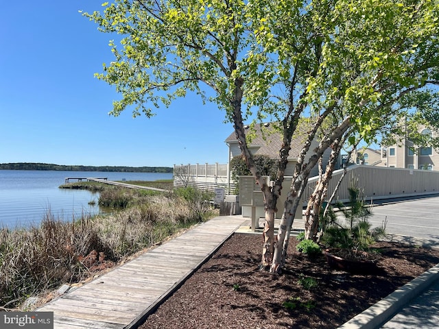 surrounding community with a water view