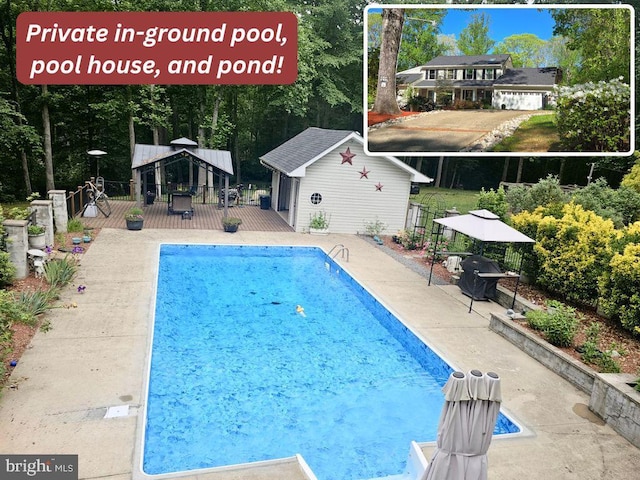 view of pool featuring an outdoor structure, fence, a fenced in pool, a patio area, and a gazebo
