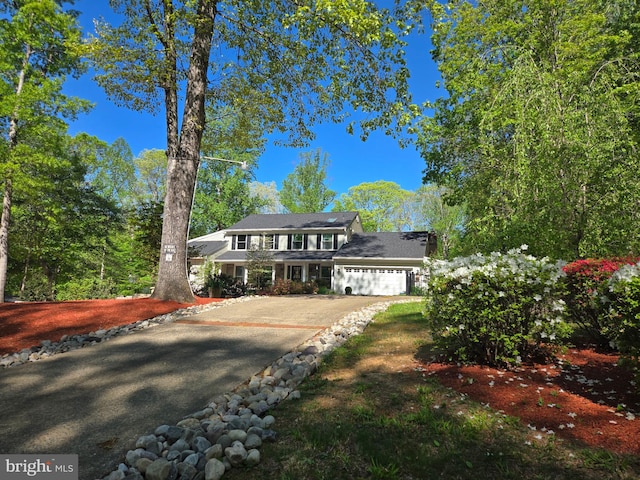 view of front of house with an attached garage and driveway