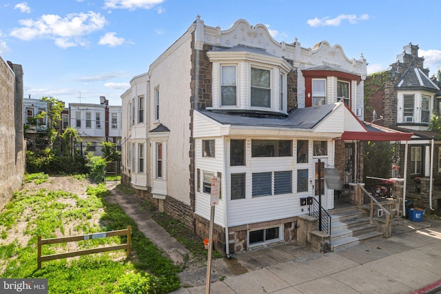939 N 50th St, Philadelphia, PA 19131 - townhome / multi-family property featuring stone siding