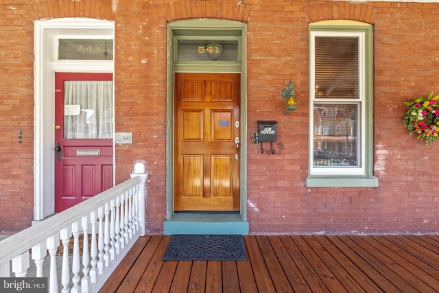 541 Madison Ave, York, PA 17404 - view of exterior entry with brick siding and a porch