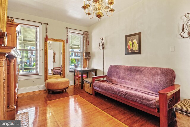 541 Madison Ave, York, PA 17404 - sitting room with baseboards, a chandelier, and wood finished floors