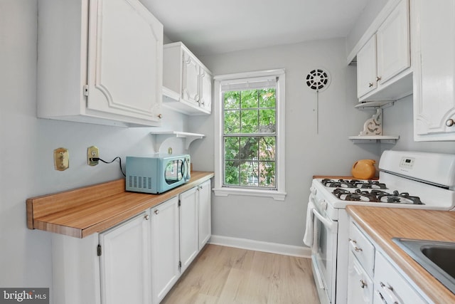 6618 Boulevard Vw Unit C1, Alexandria, VA 22307 - kitchen featuring white appliances, open shelves, light countertops, and white cabinetry