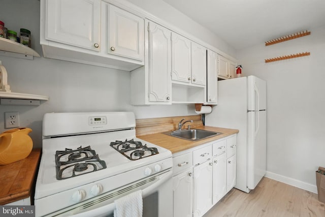 6618 Boulevard Vw Unit C1, Alexandria, VA 22307 - kitchen featuring white appliances, open shelves, light wood-style floors, and light countertops