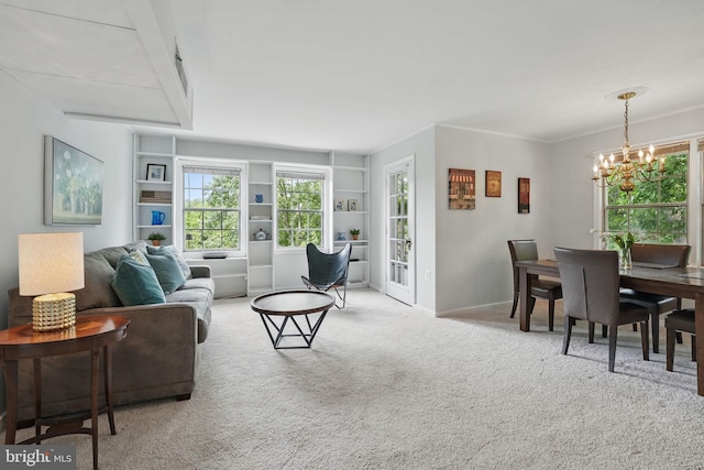 6618 Boulevard Vw Unit C1, Alexandria, VA 22307 - carpeted living room with a chandelier, plenty of natural light, and built in features