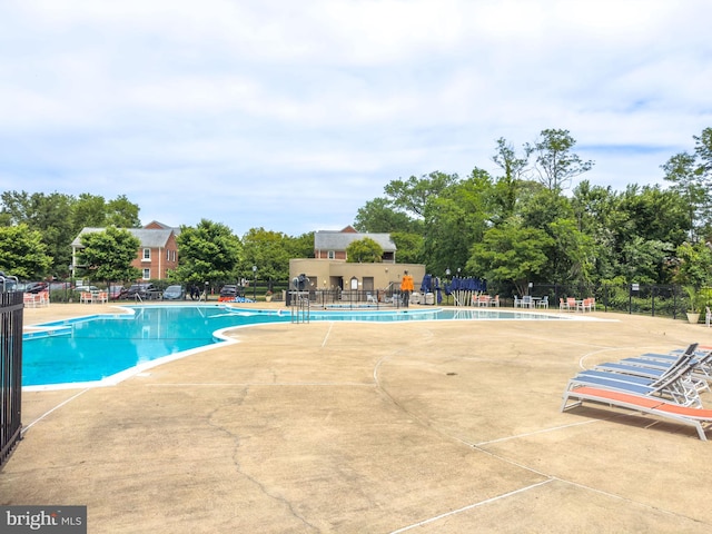 6618 Boulevard Vw Unit C1, Alexandria, VA 22307 - community pool featuring a patio and view of wooded area