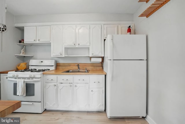 6618 Boulevard Vw Unit C1, Alexandria, VA 22307 - kitchen with white appliances, open shelves, white cabinetry, and light countertops
