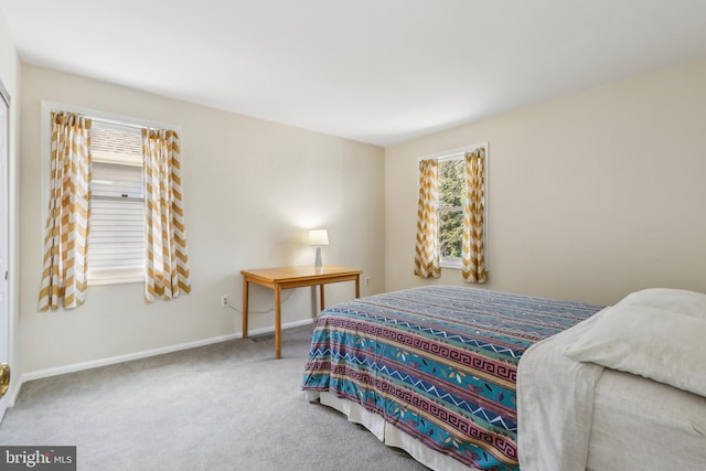 bedroom with carpet flooring and baseboards