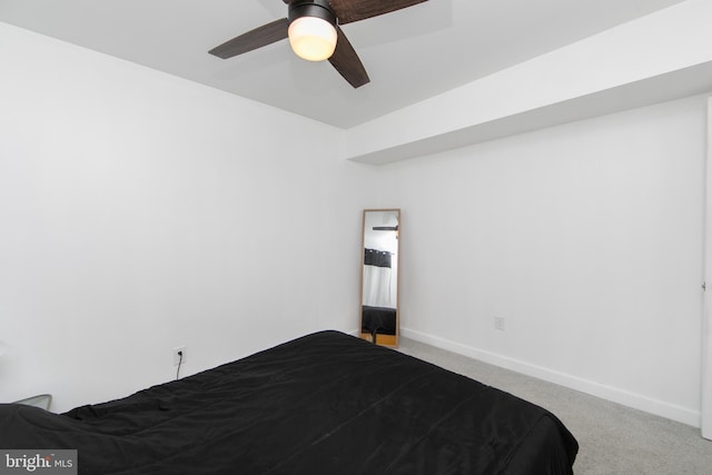 carpeted bedroom featuring baseboards and ceiling fan