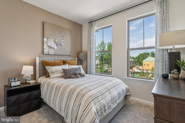 carpeted bedroom with baseboards