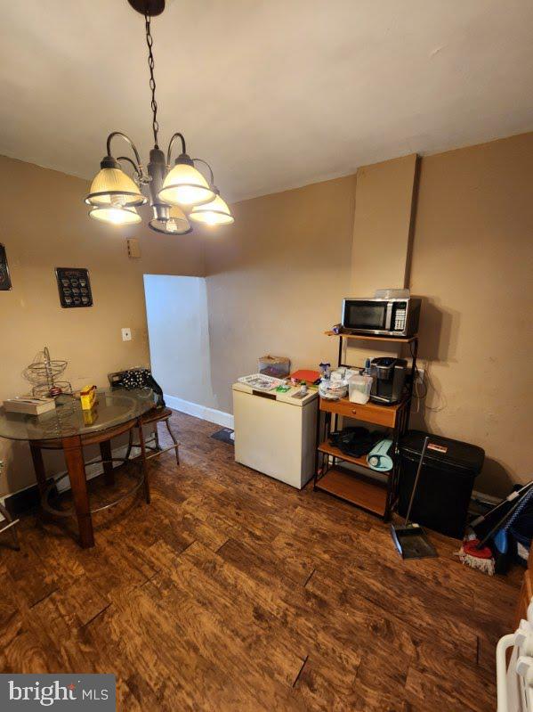 807 Spruce St, Camden, NJ 08103 - dining area featuring an inviting chandelier, baseboards, and wood finished floors