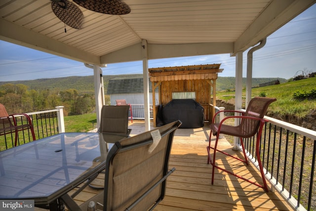 wooden terrace with outdoor dining area