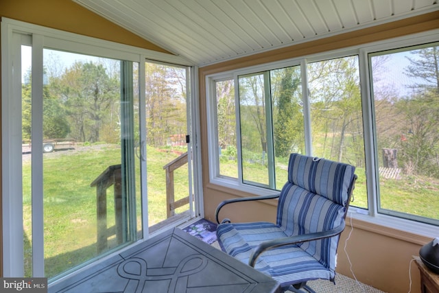 sunroom featuring a healthy amount of sunlight and lofted ceiling