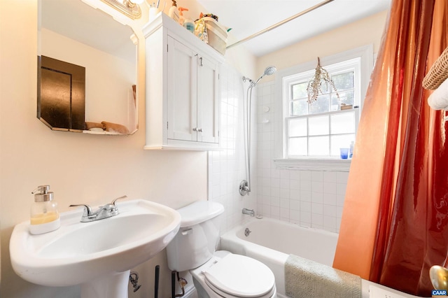 1210 Meriwether St, Charlottesville, VA 22902 - bathroom featuring toilet, bathing tub / shower combination, and a sink