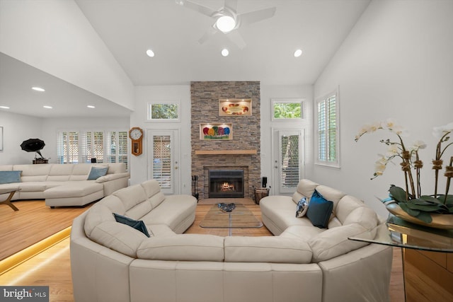 3422 Silver Maple Pl, Falls Church, VA 22042 - living area with plenty of natural light, a stone fireplace, wood finished floors, a ceiling fan, and recessed lighting