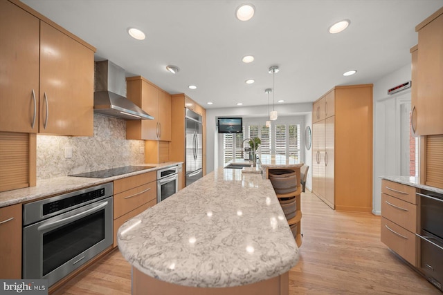 3422 Silver Maple Pl, Falls Church, VA 22042 - kitchen featuring stainless steel appliances, wall chimney exhaust hood, a sink, an island with sink, and tasteful backsplash