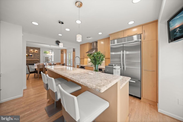 3422 Silver Maple Pl, Falls Church, VA 22042 - kitchen featuring built in fridge, recessed lighting, wall chimney range hood, light wood-style flooring, and baseboards