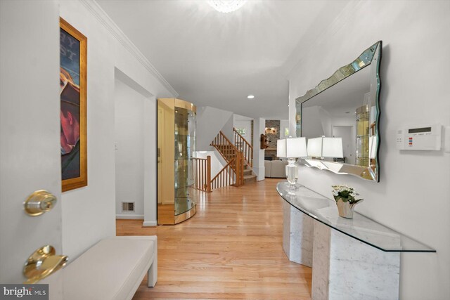 3422 Silver Maple Pl, Falls Church, VA 22042 - hall featuring stairway, light wood-style floors, ornamental molding, and recessed lighting