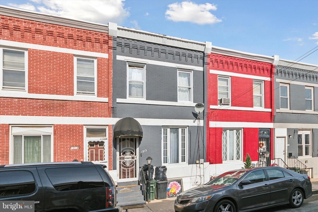townhome / multi-family property featuring brick siding