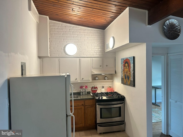 7401 18th Ave Unit 208, Hyattsville, MD 20783 - kitchen with brown cabinetry, open shelves, wooden ceiling, appliances with stainless steel finishes, and light tile patterned floors